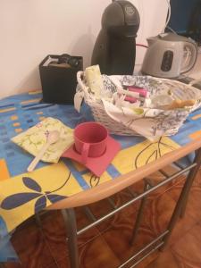 a table with a basket and other items on it at Agriturismo la Terra di Mezzo in Castellamonte