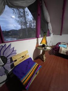 Ένα ή περισσότερα κρεβάτια σε δωμάτιο στο Cabaña Quinde