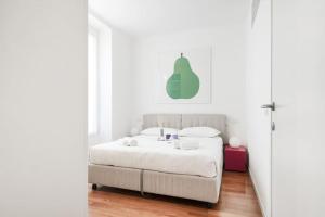 Ένα ή περισσότερα κρεβάτια σε δωμάτιο στο Easylife - Milano - Bixio 11 - Porta Venezia