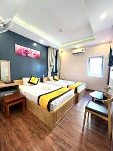 Postel nebo postele na pokoji v ubytování Hoàng Gia Hotel Côn Đảo
