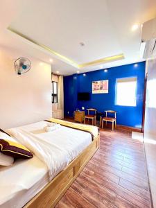 Postel nebo postele na pokoji v ubytování Hoàng Gia Hotel Côn Đảo