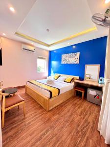 Postel nebo postele na pokoji v ubytování Hoàng Gia Hotel Côn Đảo