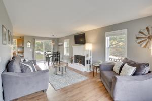 a living room with two couches and a fireplace at 6 Mi to Sunday River Condo Near Bethel Village! in Bethel