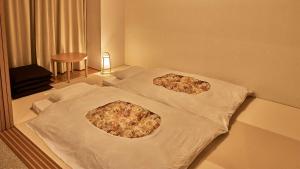 Postel nebo postele na pokoji v ubytování Tokyu Vacations Izukougen