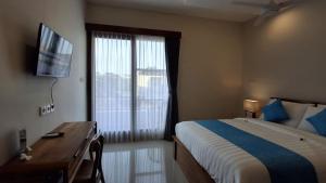 Kutus Bali Guesthouse客房内的一张或多张床位