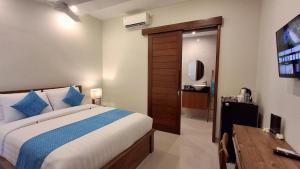 Postel nebo postele na pokoji v ubytování Kutus Bali Guesthouse + 23 fotografií