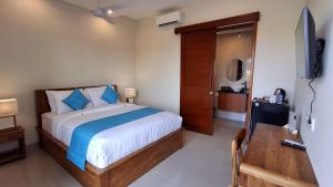 Kutus Bali Guesthouse客房内的一张或多张床位