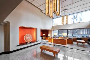a living room with a large fireplace in a building at Tokyu Vacations Kyoto in Kyoto