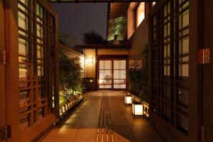 a hallway of a building at night with lights at Tokyu Vacations Kyoto in Kyoto