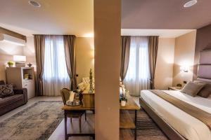 Postel nebo postele na pokoji v ubytování Delle Vittorie Luxury Rooms&Suites