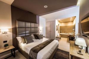 Postel nebo postele na pokoji v ubytování Delle Vittorie Luxury Rooms&Suites