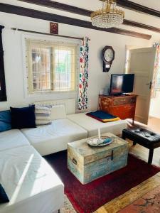 a living room with a white couch and a table at Awesome Home In Stockholm With 1 Bedrooms And Wifi in Stockholm
