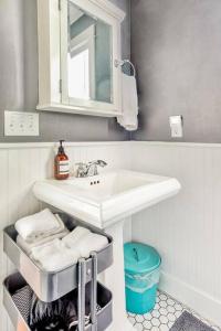 a bathroom with a sink and a mirror at Seabrook 2 Bedroom cottage with hot tub, pets OK in Pacific Beach +23 photos