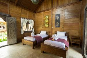 Postel nebo postele na pokoji v ubytování Benthos Bali Dive Resort