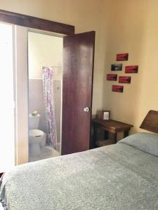 Postel nebo postele na pokoji v ubytování La Casita de Juana Pancha
