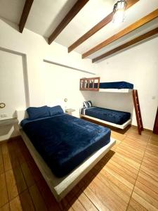 Postel nebo postele na pokoji v ubytování Casa campo Mauri Capacidad 23 personas A 12 minutos del Óvalo de Cieneguilla