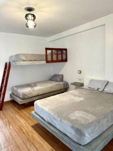 Postel nebo postele na pokoji v ubytování Casa campo Mauri Capacidad 23 personas A 12 minutos del Óvalo de Cieneguilla