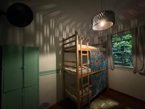 Ένα ή περισσότερα κρεβάτια σε δωμάτιο στο Savassi Hostel