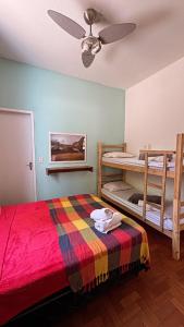 Ένα ή περισσότερα κρεβάτια σε δωμάτιο στο Savassi Hostel