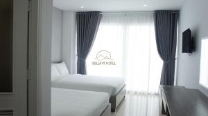 Postel nebo postele na pokoji v ubytování Bella Hotel Bai Sau Vung Tau
