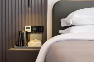 Łóżko lub łóżka w pokoju w obiekcie Shanming Boutique Homestay