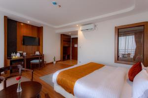 Hotel Sarathi客房内的一张或多张床位