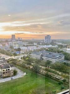 a view of a city with buildings and a park at Cozy Shaftsbury Netflix tv box pakin wifi king bed netflix wifi free parking 1116 in Cyberjaya