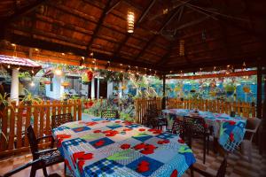 a dining room with a table and chairs at Marari John Villa in Mararikulam