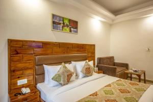 Postel nebo postele na pokoji v ubytování Airport Hotel Roomsity Pride