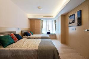 Postel nebo postele na pokoji v ubytování Airport Hotel Roomsity Pride