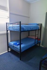 Postel nebo postele na pokoji v ubytování Hotel Metropole Proserpine