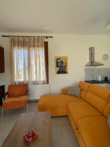 a living room with a couch and a table at Belvedere 3 - Studio in Drama +22 photos