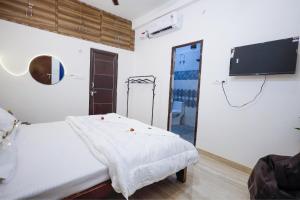 TV a/nebo společenská místnost v ubytování Kasha Homestay