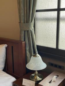Postel nebo postele na pokoji v ubytování Hotel Fukudaya