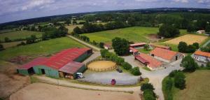 an overhead view of a large building with a field at Studio privée chez vos hôtes in Vendrennes