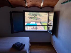 Ένα ή περισσότερα κρεβάτια σε δωμάτιο στο Casa Rural La Charquera +9 φωτογραφίες