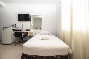 Televiisor ja/või meelelahutuskeskus majutusasutuses Allisa Resort Hotel