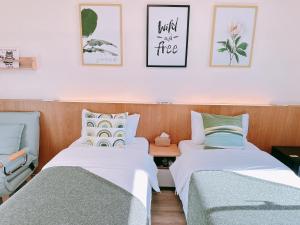 Postel nebo postele na pokoji v ubytování Gardenstay