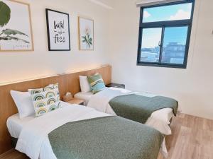 Postel nebo postele na pokoji v ubytování Gardenstay