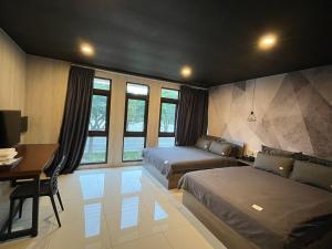 Una cama o camas en una habitación de 宜蘭品閣獨棟民宿