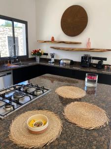 a kitchen with a stove and a counter top at Dar Essa in Essaouira
