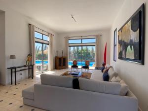 a living room with a couch and a table at Dar Essa in Essaouira