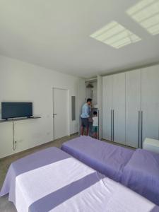 Posteľ alebo postele v izbe v ubytovaní Villa Vannì