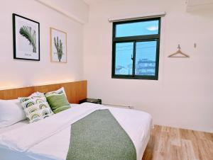 Postel nebo postele na pokoji v ubytování Gardenstay