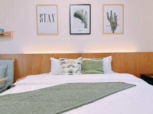 Postel nebo postele na pokoji v ubytování Gardenstay