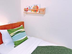 Postel nebo postele na pokoji v ubytování Gardenstay