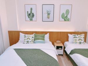 Postel nebo postele na pokoji v ubytování Gardenstay