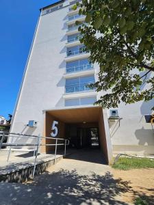 a building with the number on it at Skyline Prishtina Studio Apartment in Pristina +6 photos