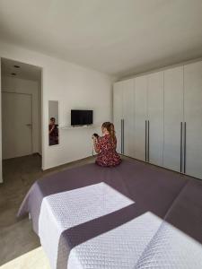 Televízia a/alebo spoločenská miestnosť v ubytovaní Villa Vannì