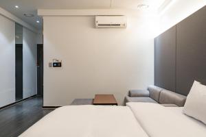 Katil atau katil-katil dalam bilik di Hotel THE ART UIWANG